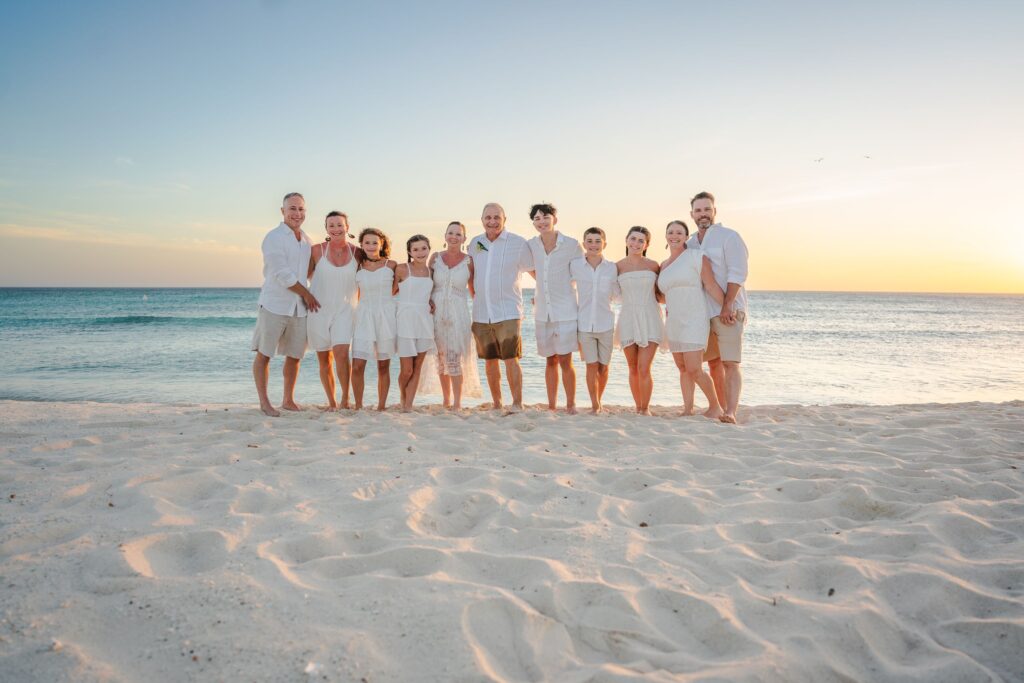 Family picture on Arashi beach at sunset after vow renewal