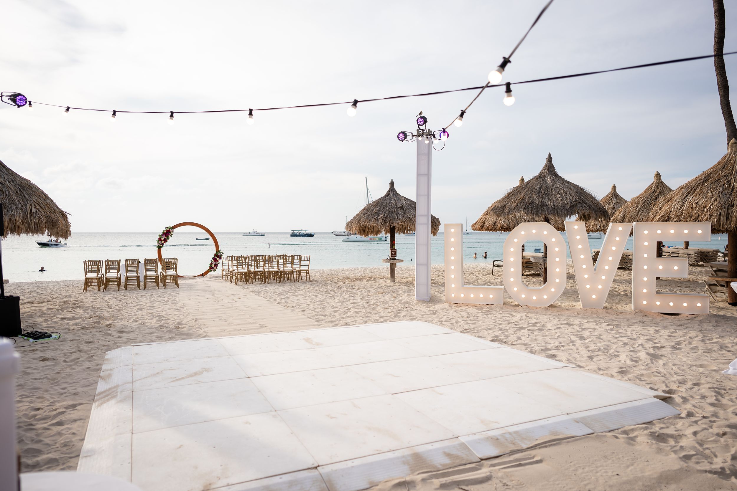 Aruba wedding ceremony with large light up letters spelling "LOVE"