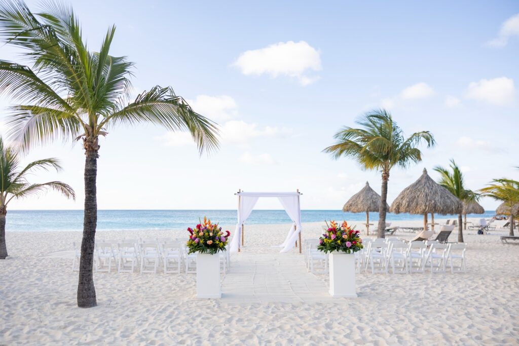 Aruba ceremony setup with aisle and flowers on beach