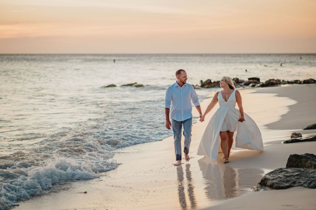 Aruba elopement couple walking beach