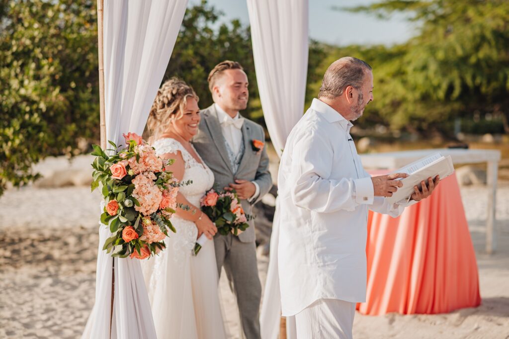 Couple smiling with Aruba officiant
