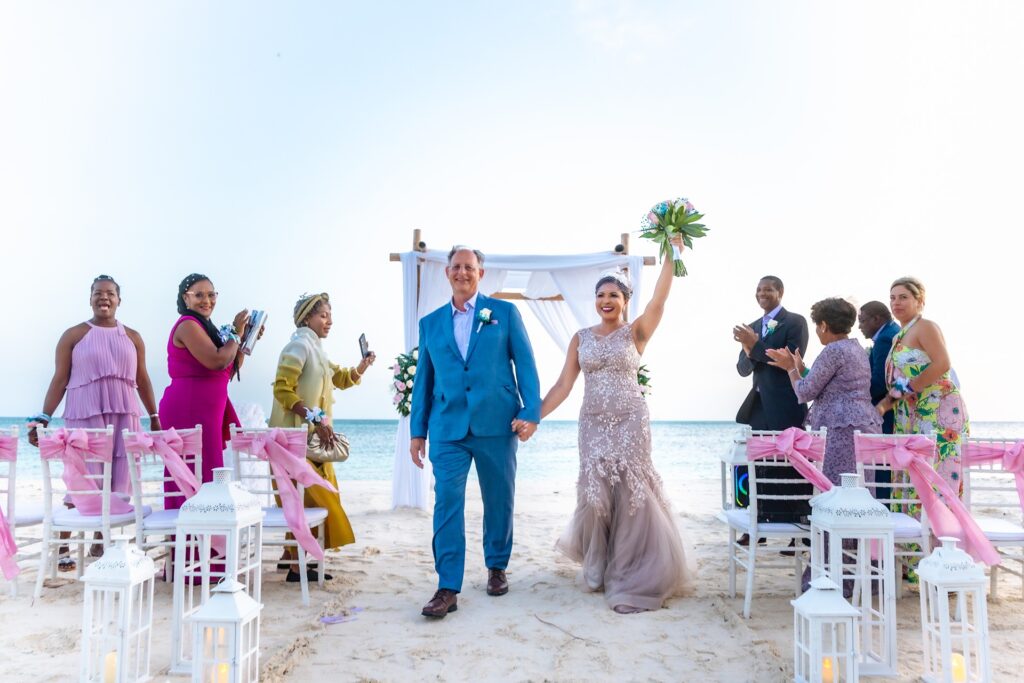 Bride holding up bouquet after Aruba elopement ceremony