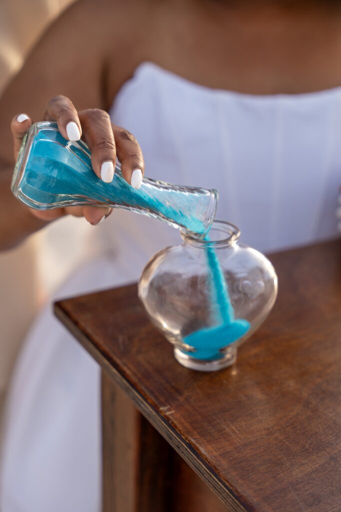 Bride pouring sand at Aruba elopement