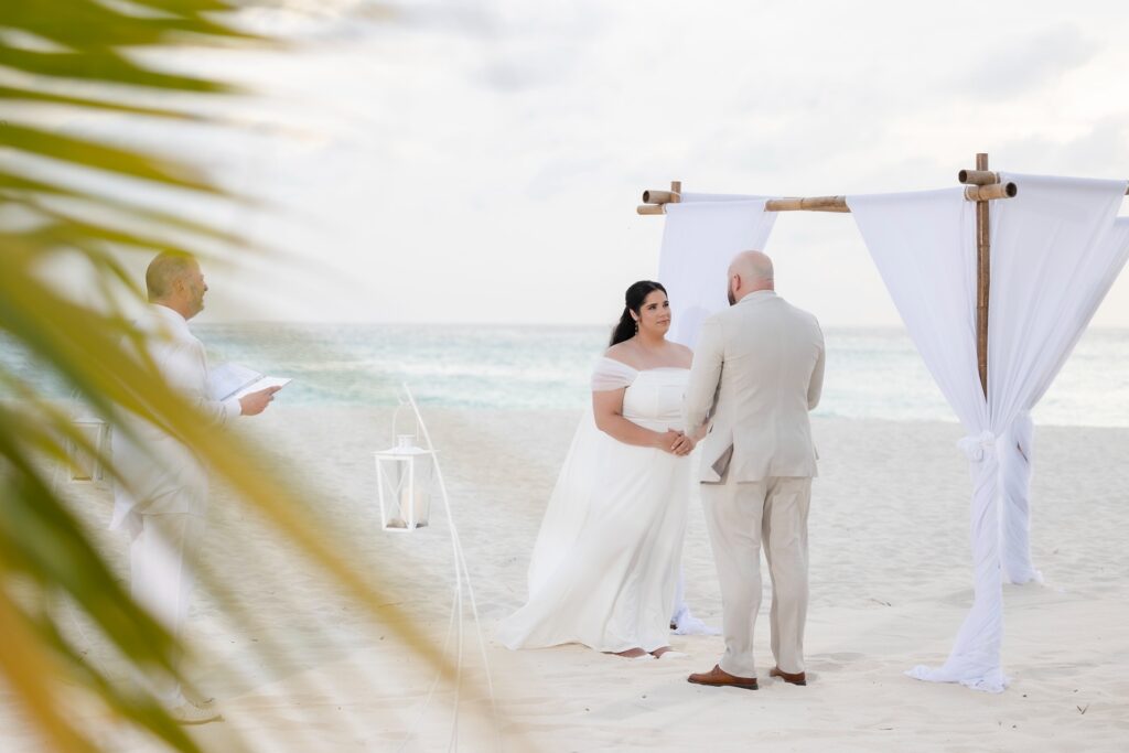 Aruba officiant performing ceremony on beach with couple