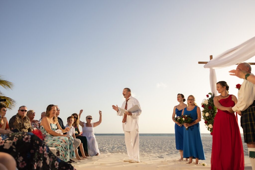 Aruba elopement wedding officiant speaking to guests during ceremony